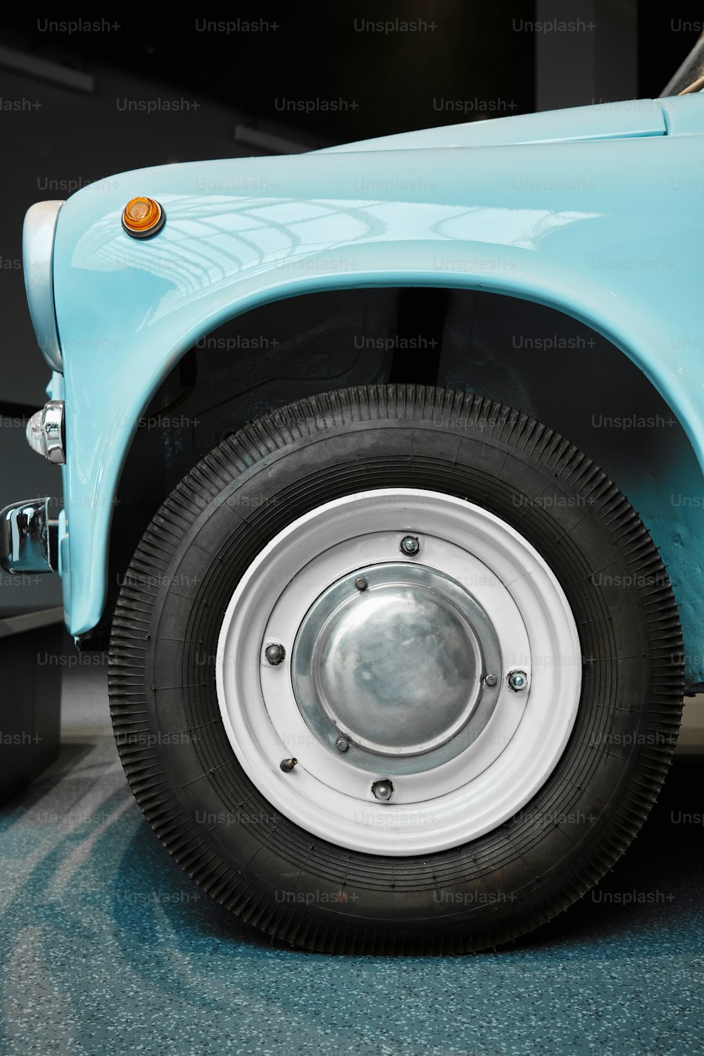 a close up of a blue truck tire