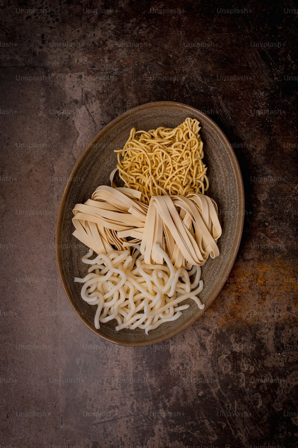 a plate of noodles and noodles on a table
