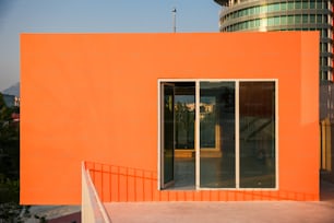 an orange building with a staircase leading to it