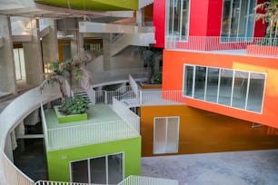 a multicolored building with a spiral staircase