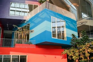 a multicolored building with a balcony and balconies