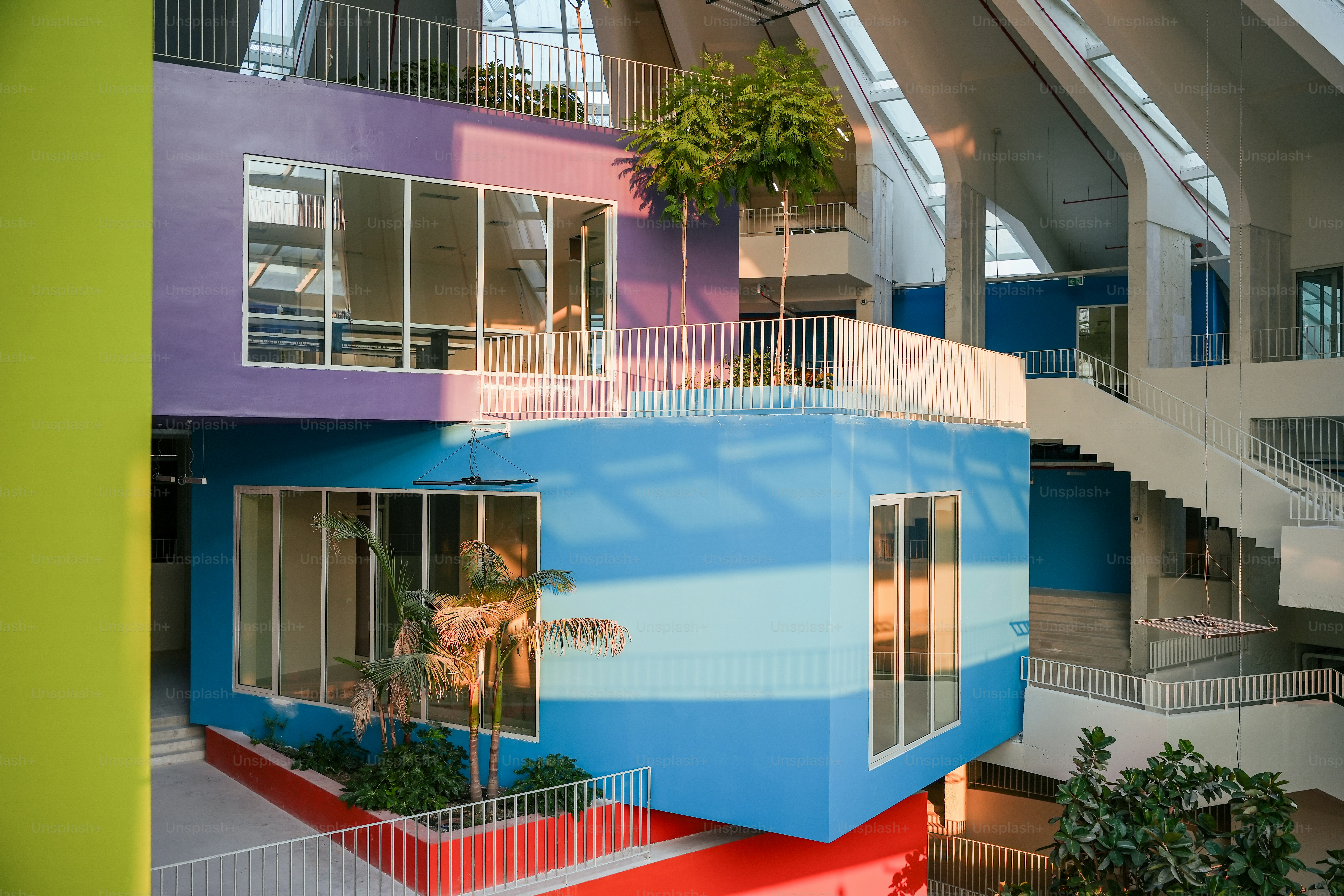 A multicolored building with a staircase leading up to it photo ...