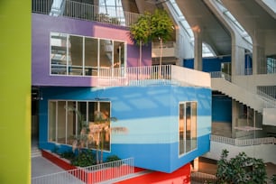 a multicolored building with a staircase leading up to it