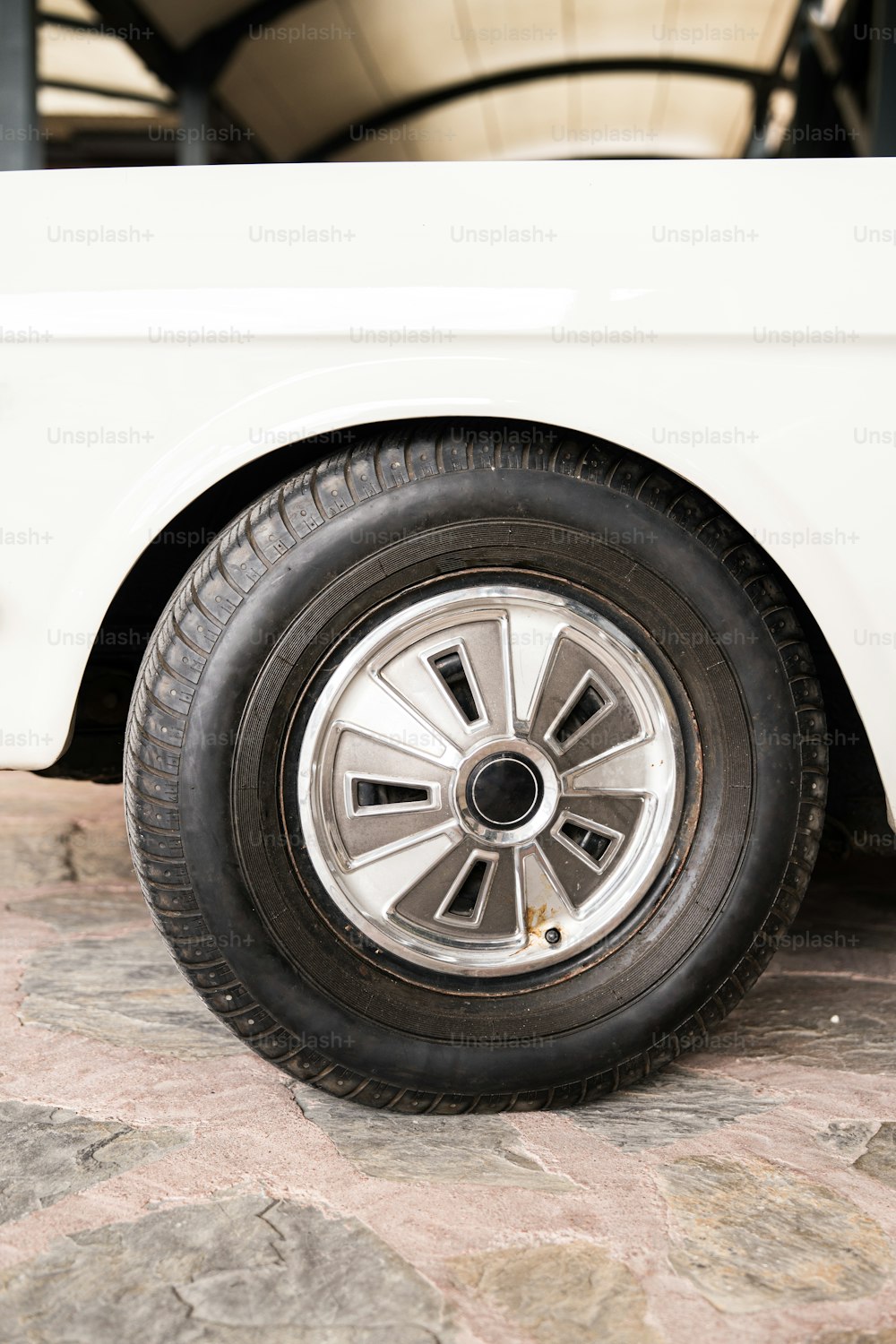 a close up of a tire on a white truck
