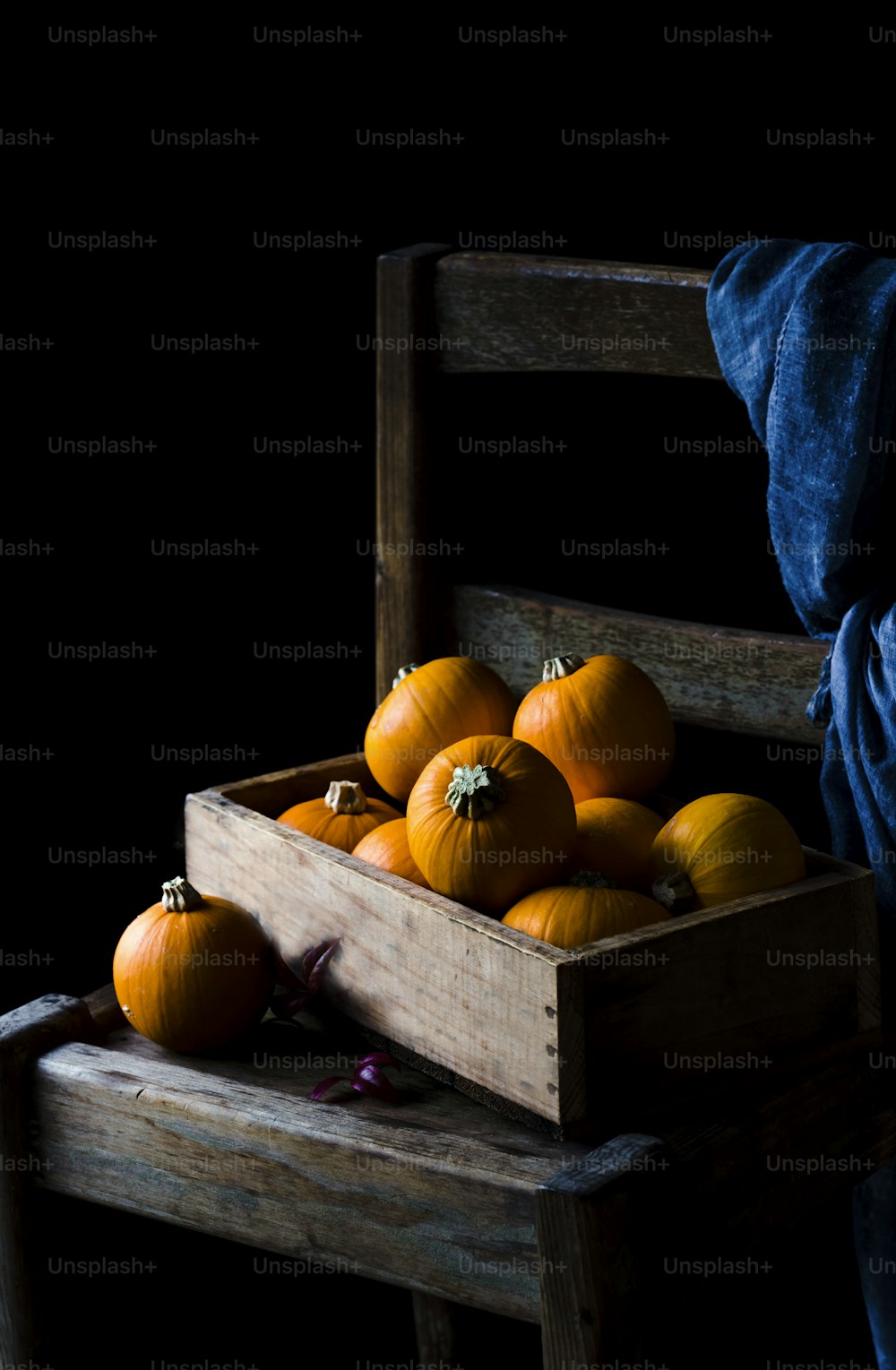 a wooden crate filled with lots of oranges