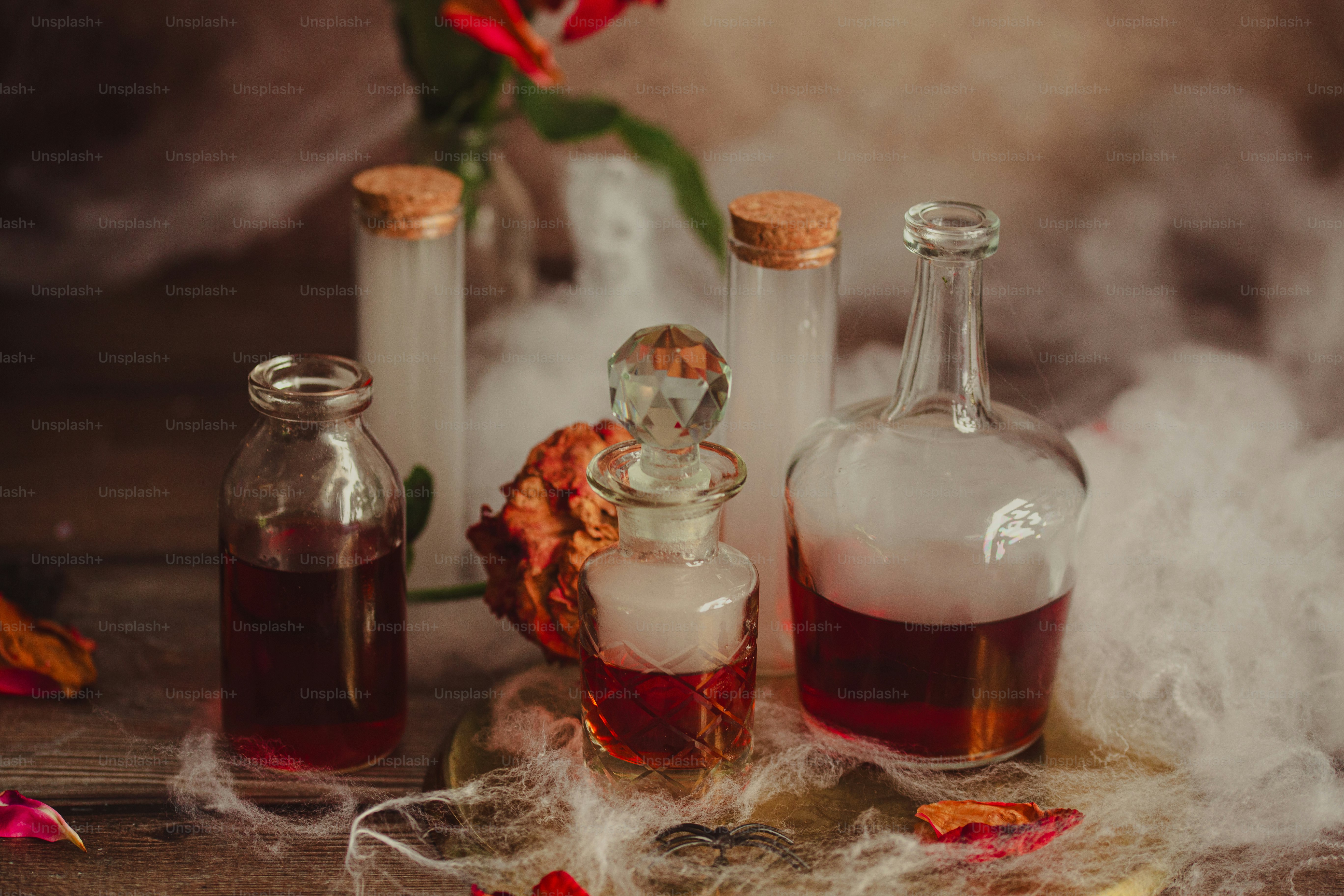 three bottles filled with liquid sitting on top of a table