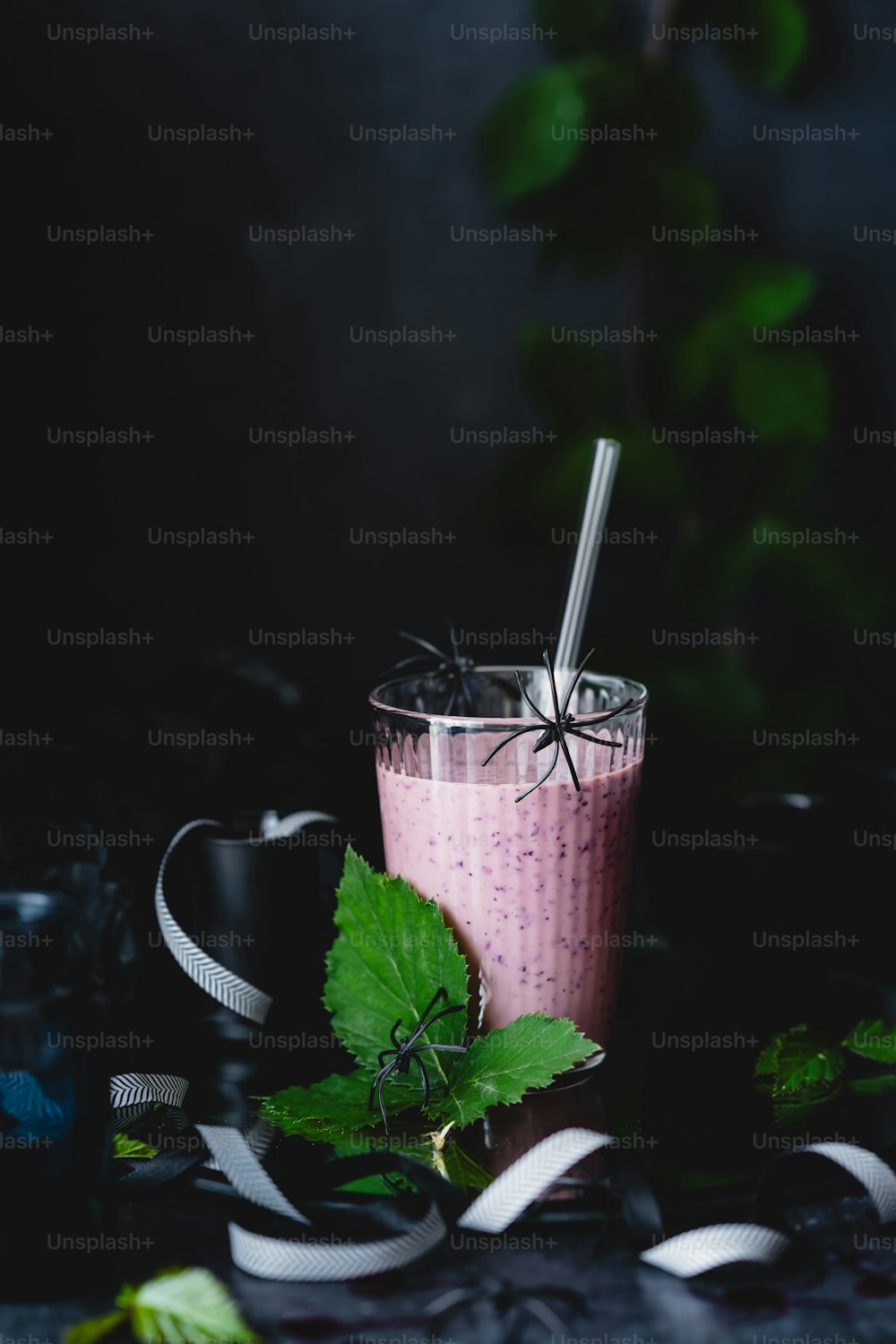 a drink with a straw in it sitting on a table