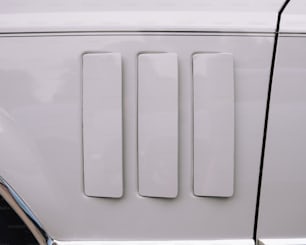 a close up of a white door handle on a car