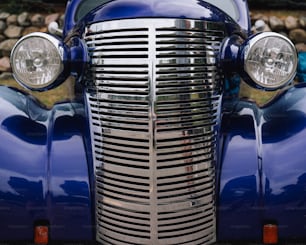 a close up of the front of a classic car