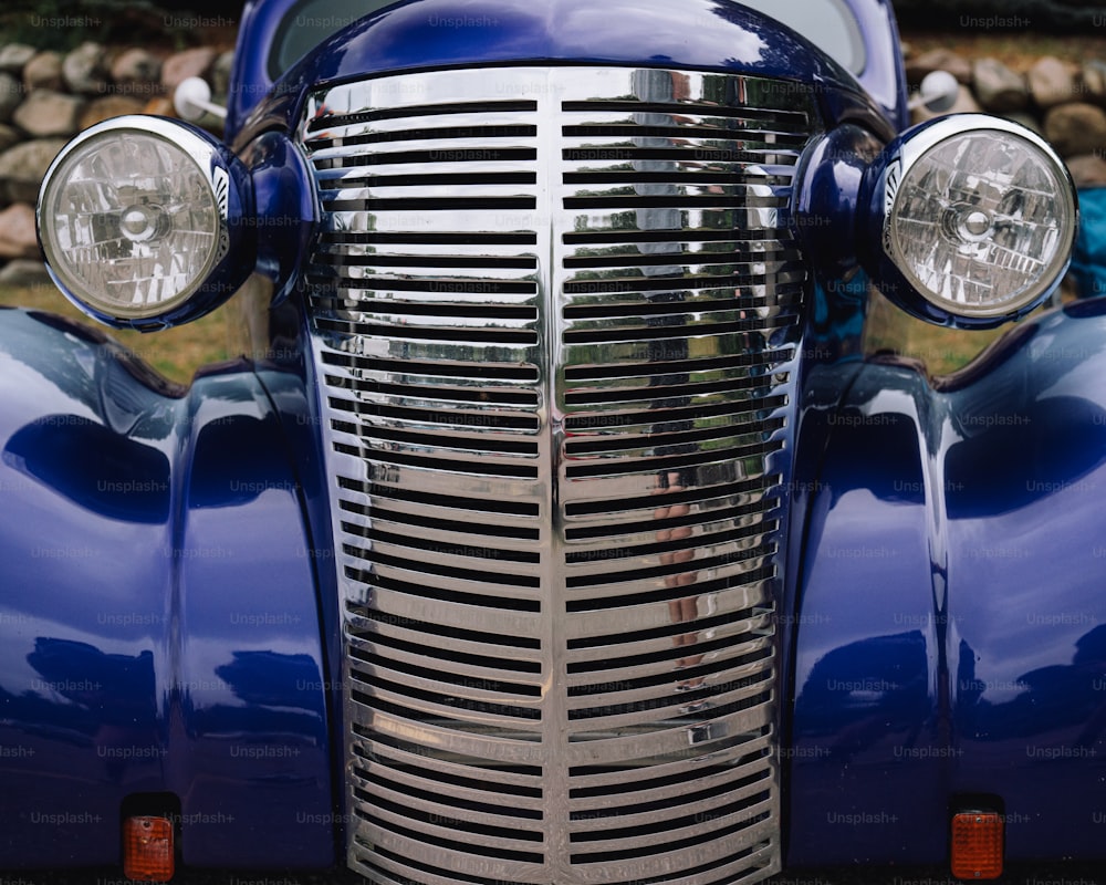 a close up of the front of a classic car