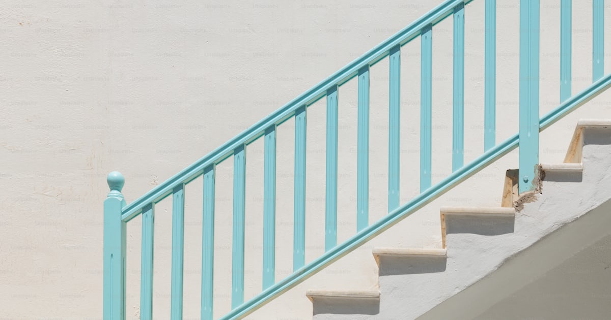 A white building with a blue railing and a window photo – Greece Image ...