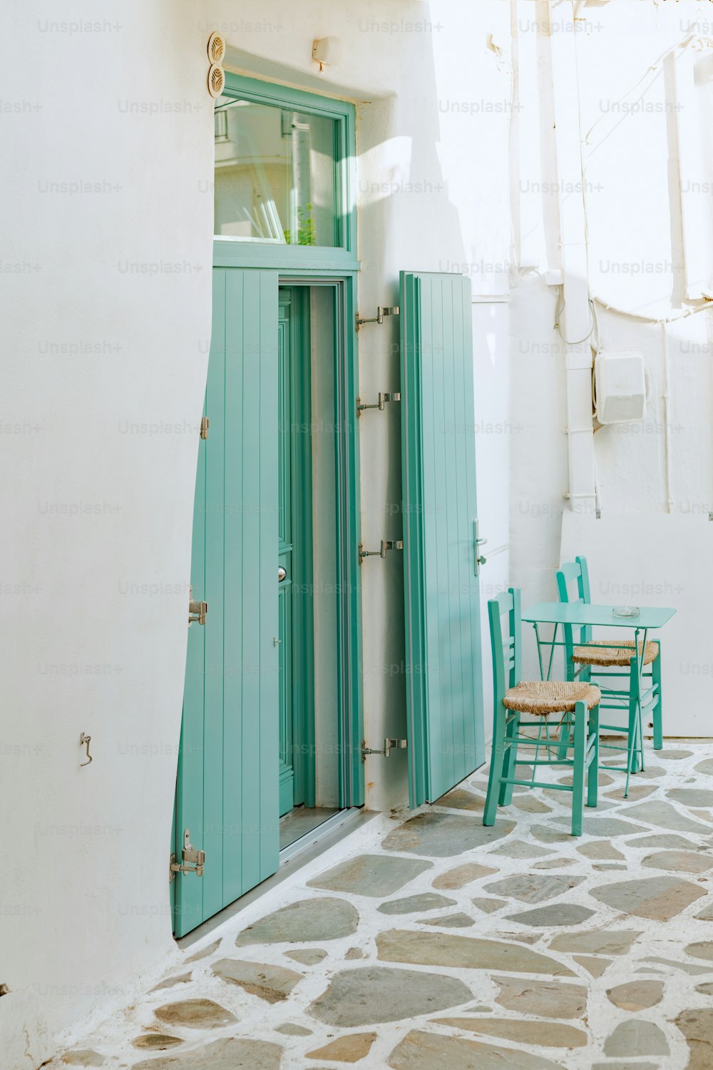 a table and chairs outside of a building