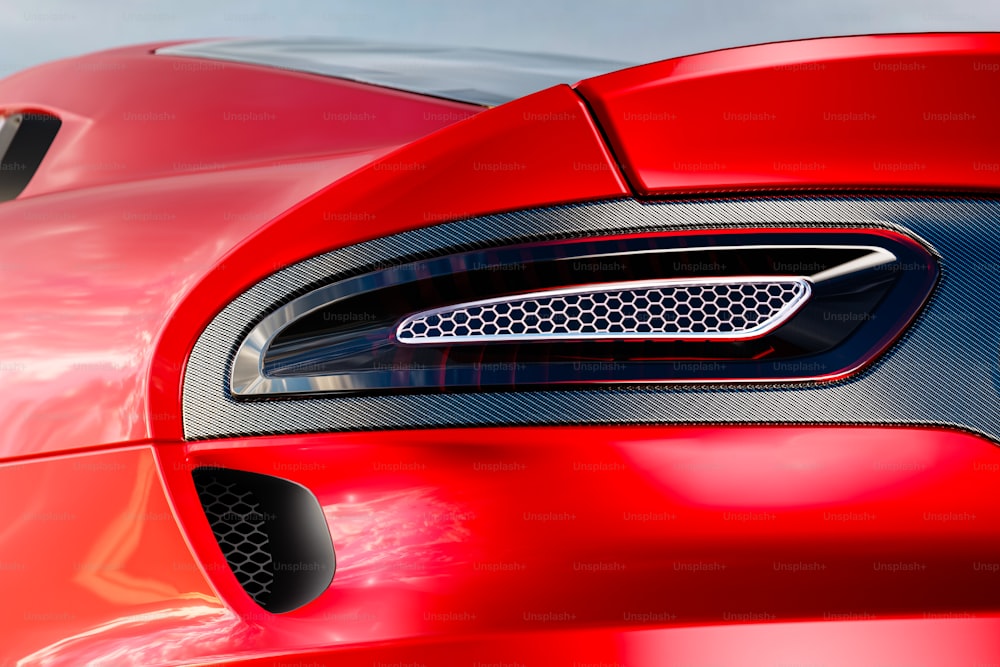 the front end of a red sports car