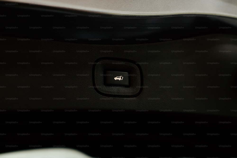 a close up of a button on a car seat