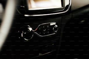 a close up of a car's dashboard with a television