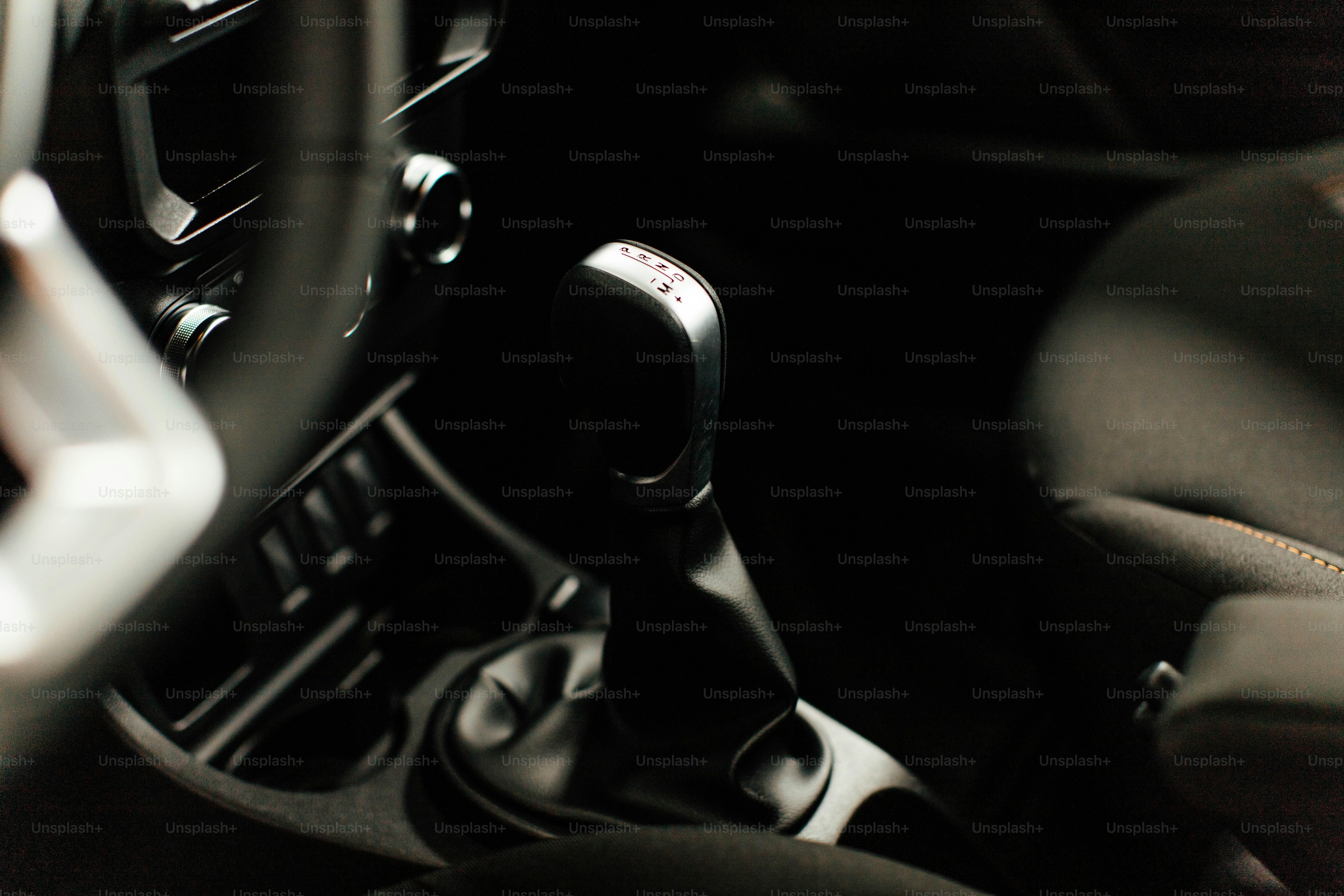 a close up of a car dashboard with a steering wheel