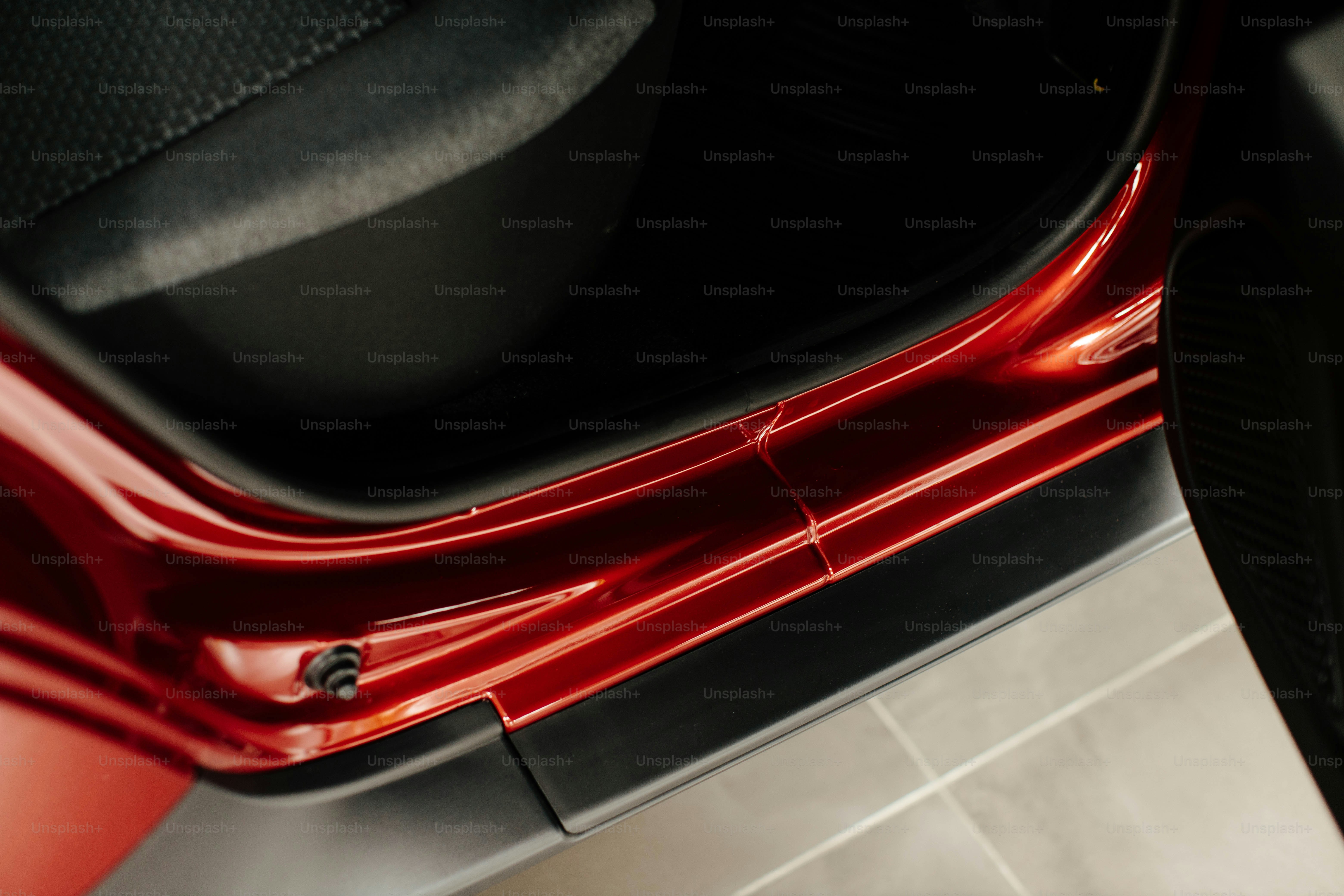 a close up of the rear end of a red car