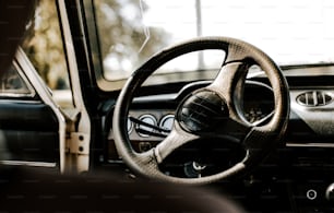 a steering wheel and dashboard of a car