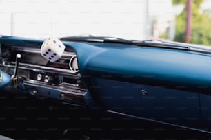 a car dashboard with a dice in the center of it