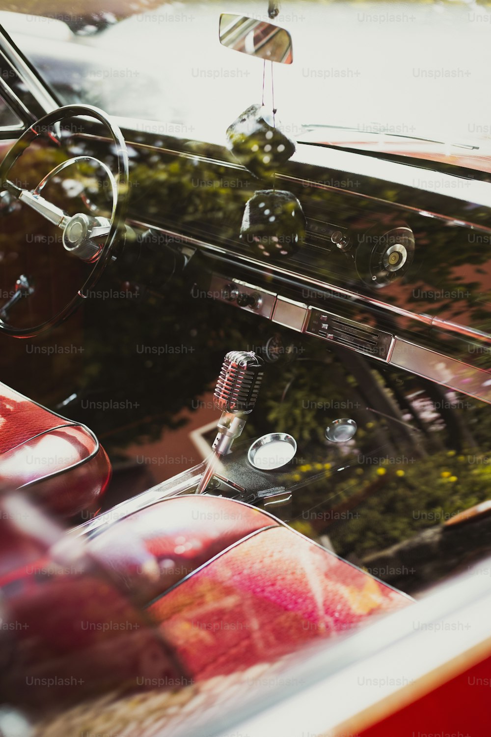 the interior of a classic car with the door open