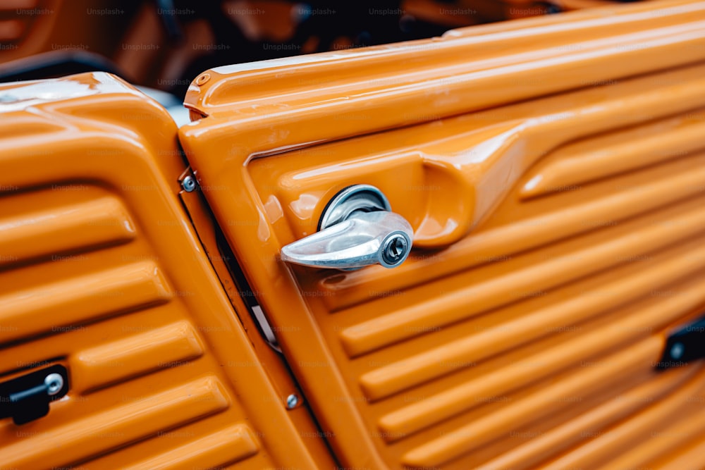 a close up of a pair of orange suitcases