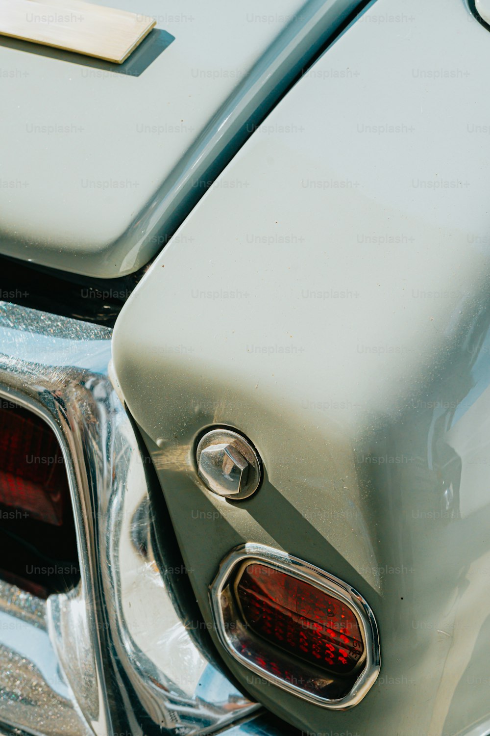 a close up of the tail lights of a classic car