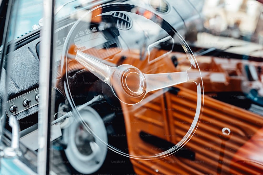 a close up of a car's steering wheel and dashboard