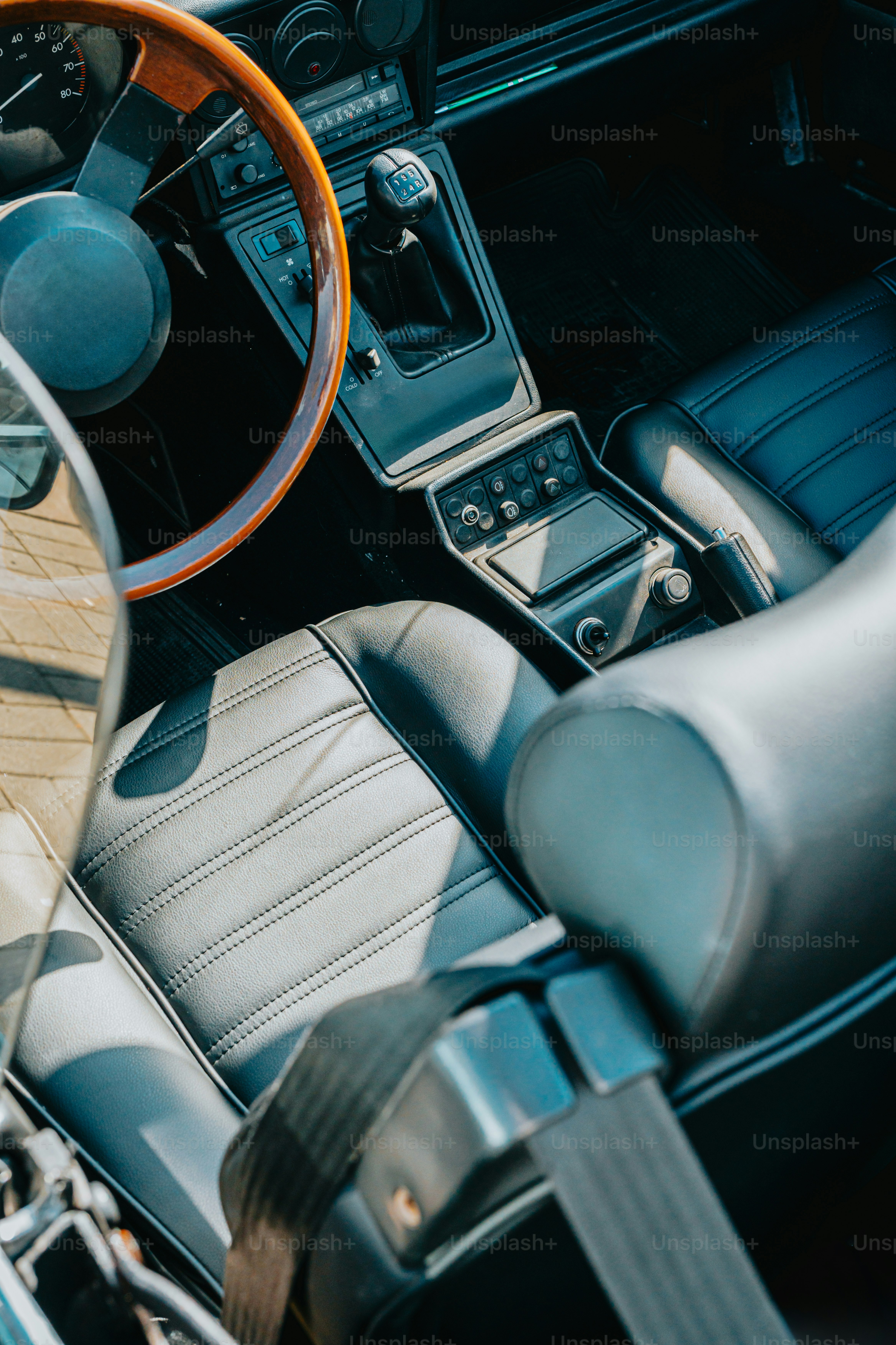 the interior of a car with a steering wheel and dashboard