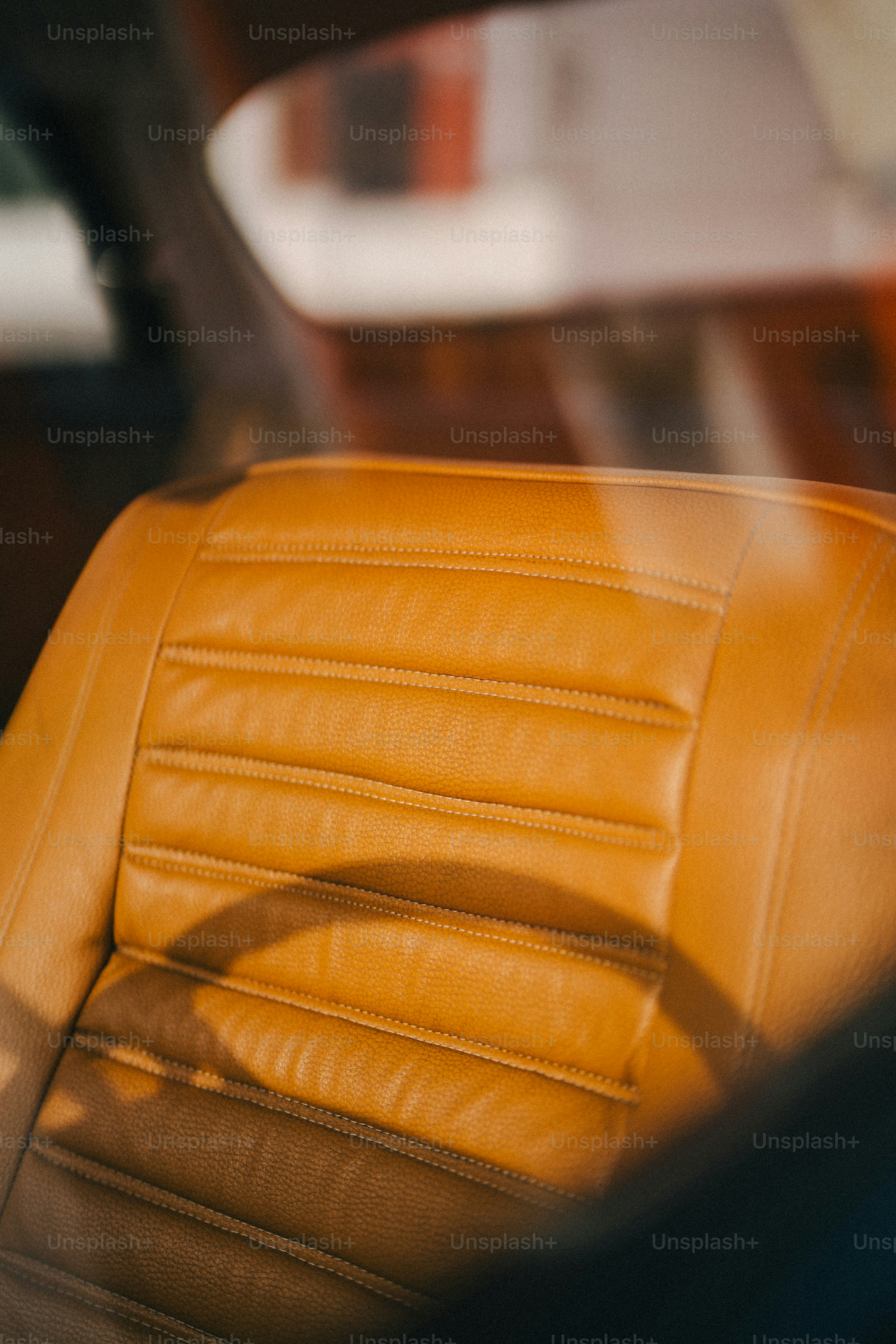 The interior of a car with a yellow leather seat photo Car Image on