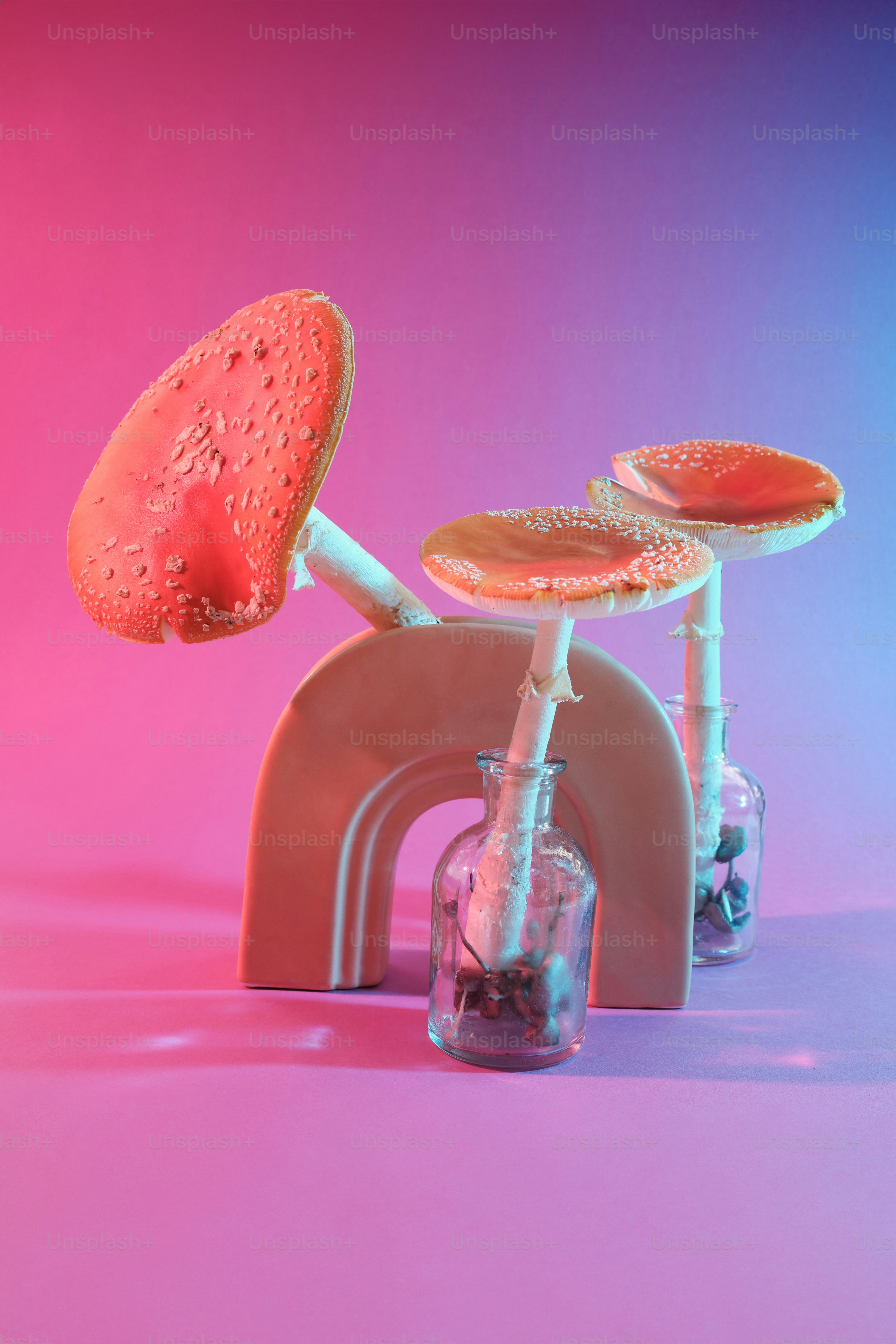 a pink and blue background with a toy bike