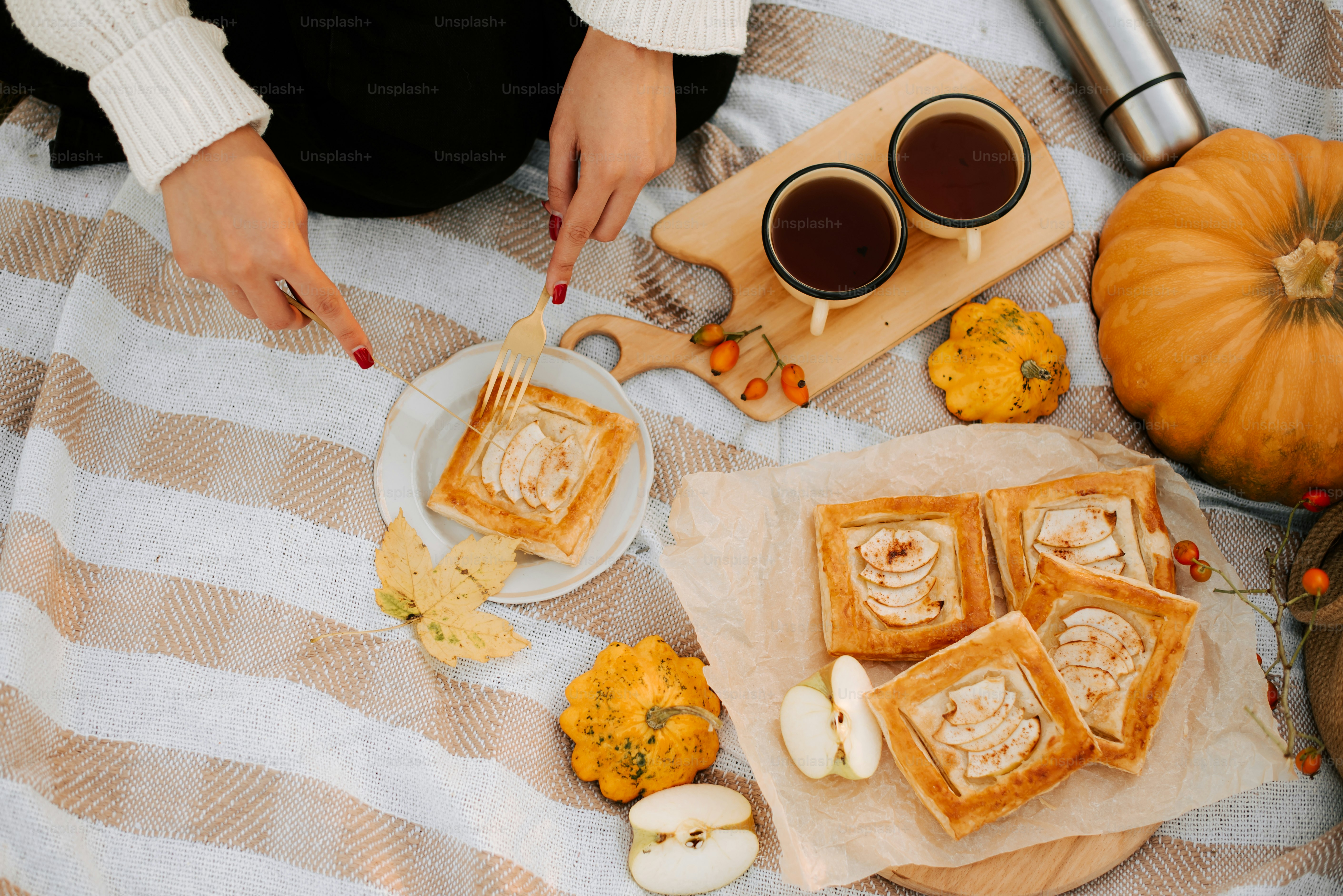 a table topped with a plate of food and a cup of coffee
