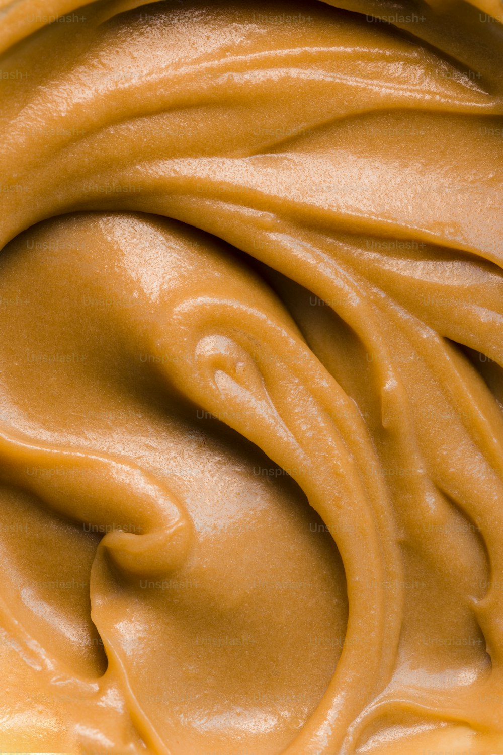 a close up of a bowl of peanut butter