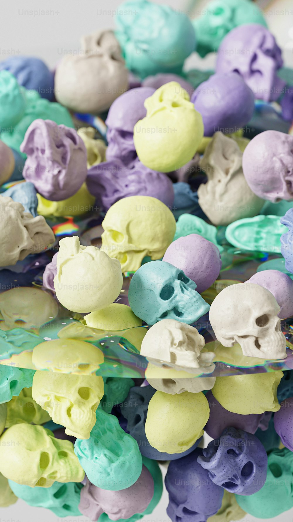 a bowl filled with lots of different colored skulls