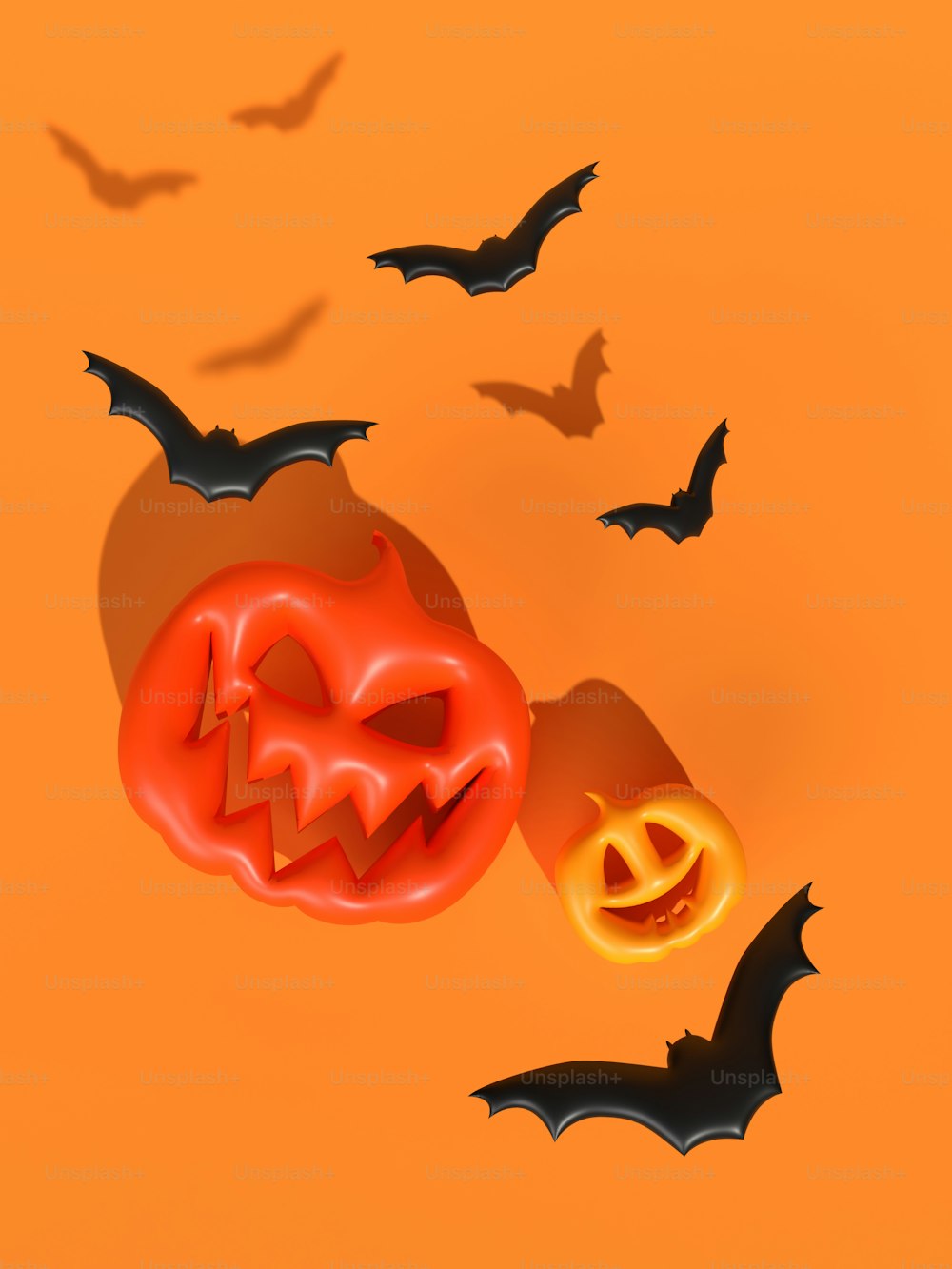 a group of bats flying around a pumpkin