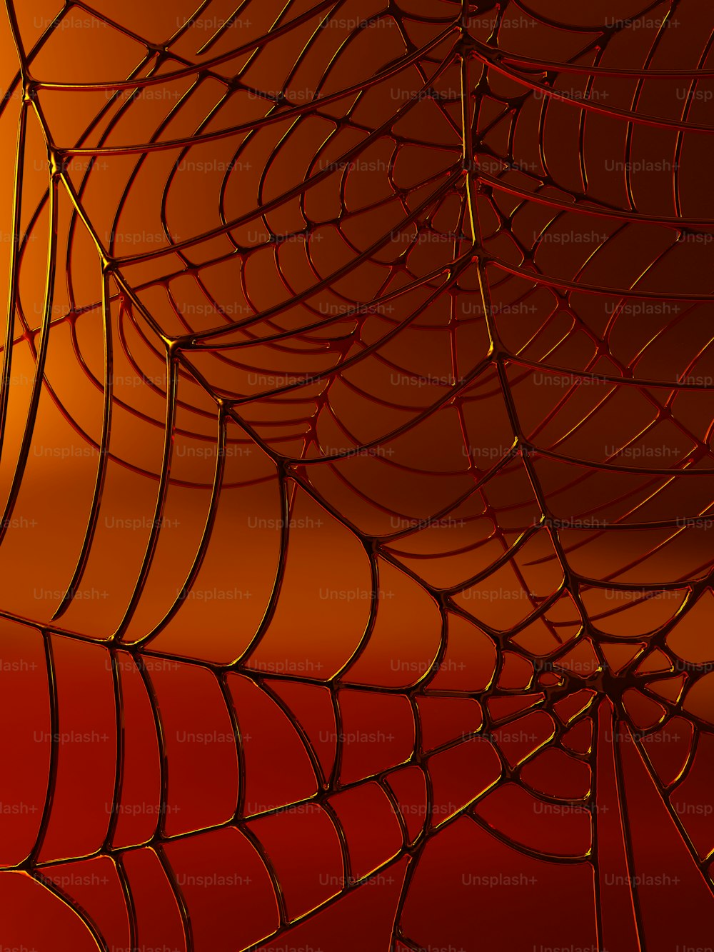 Un primer plano de una tela de araña sobre un fondo rojo