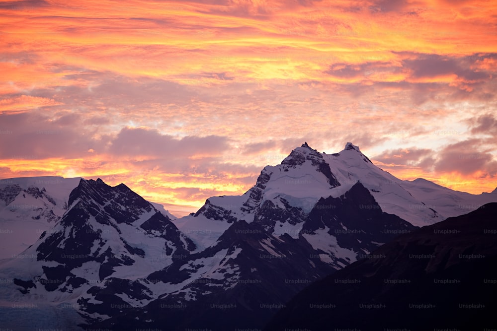 a view of a mountain range at sunset