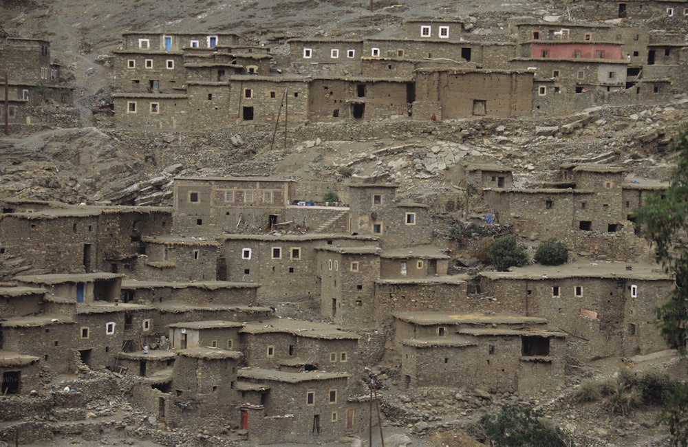 a group of buildings built into the side of a mountain