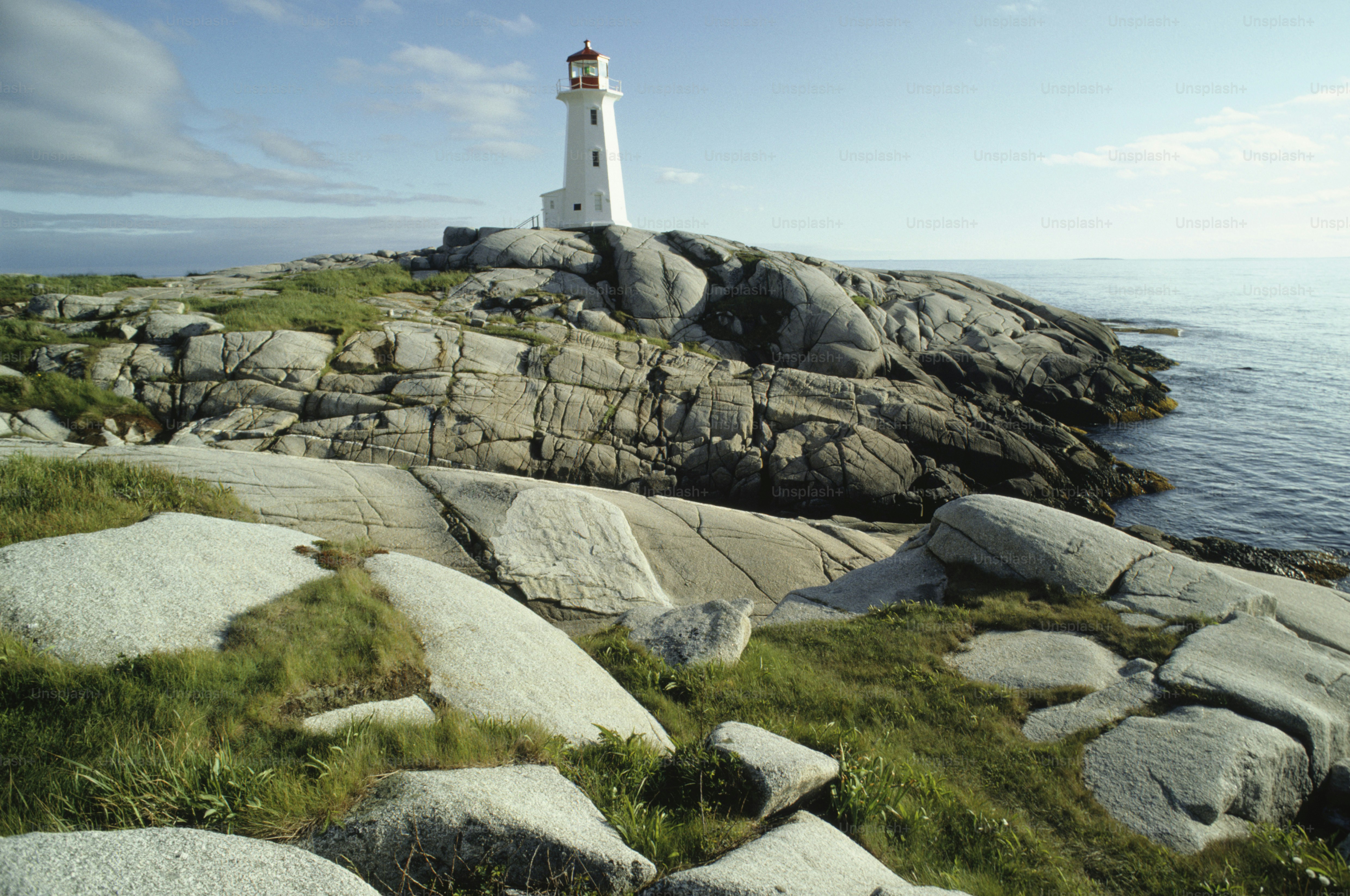 a light house sitting on top of a rocky cliff