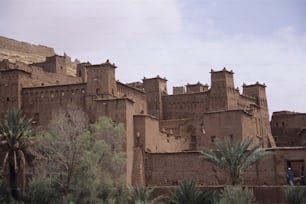 a large brown building with towers on top of it