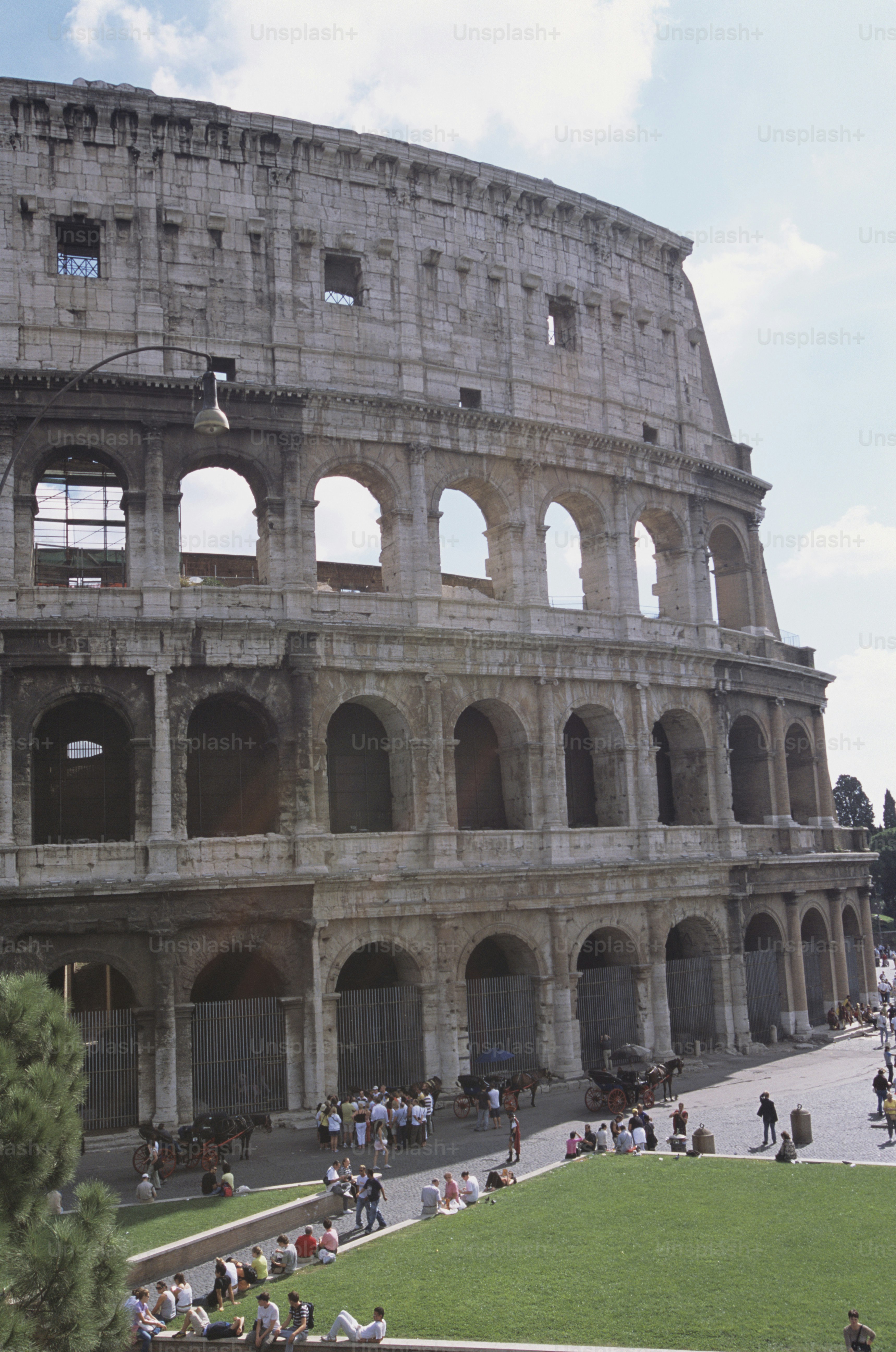 a group of people standing in front of an old building