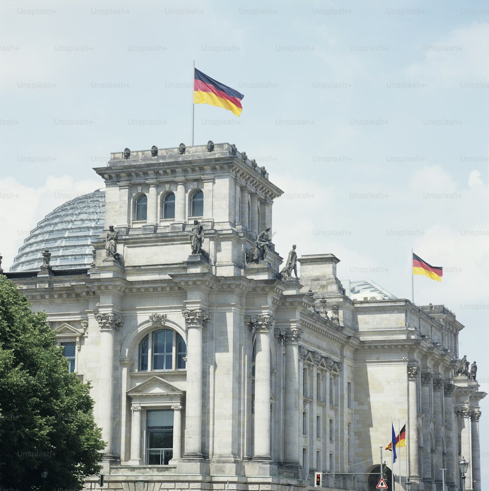 a large building with a flag on top of it