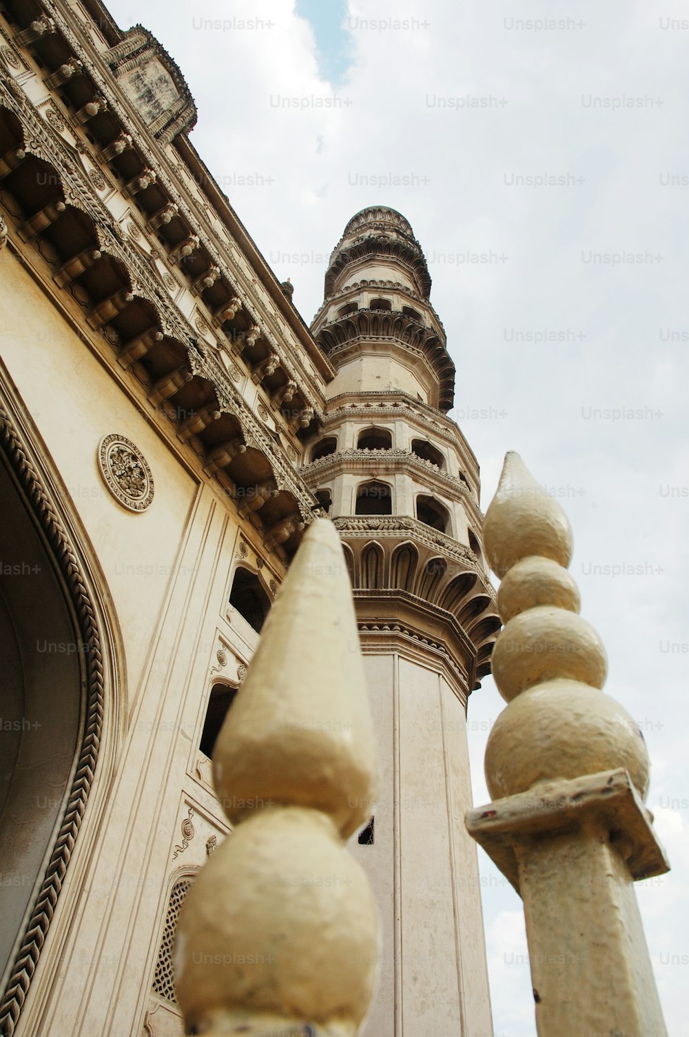 a tall tower with a clock on the side of it