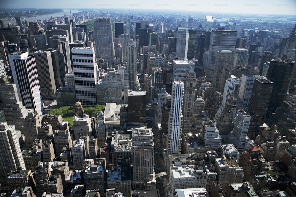 an aerial view of a city with tall buildings