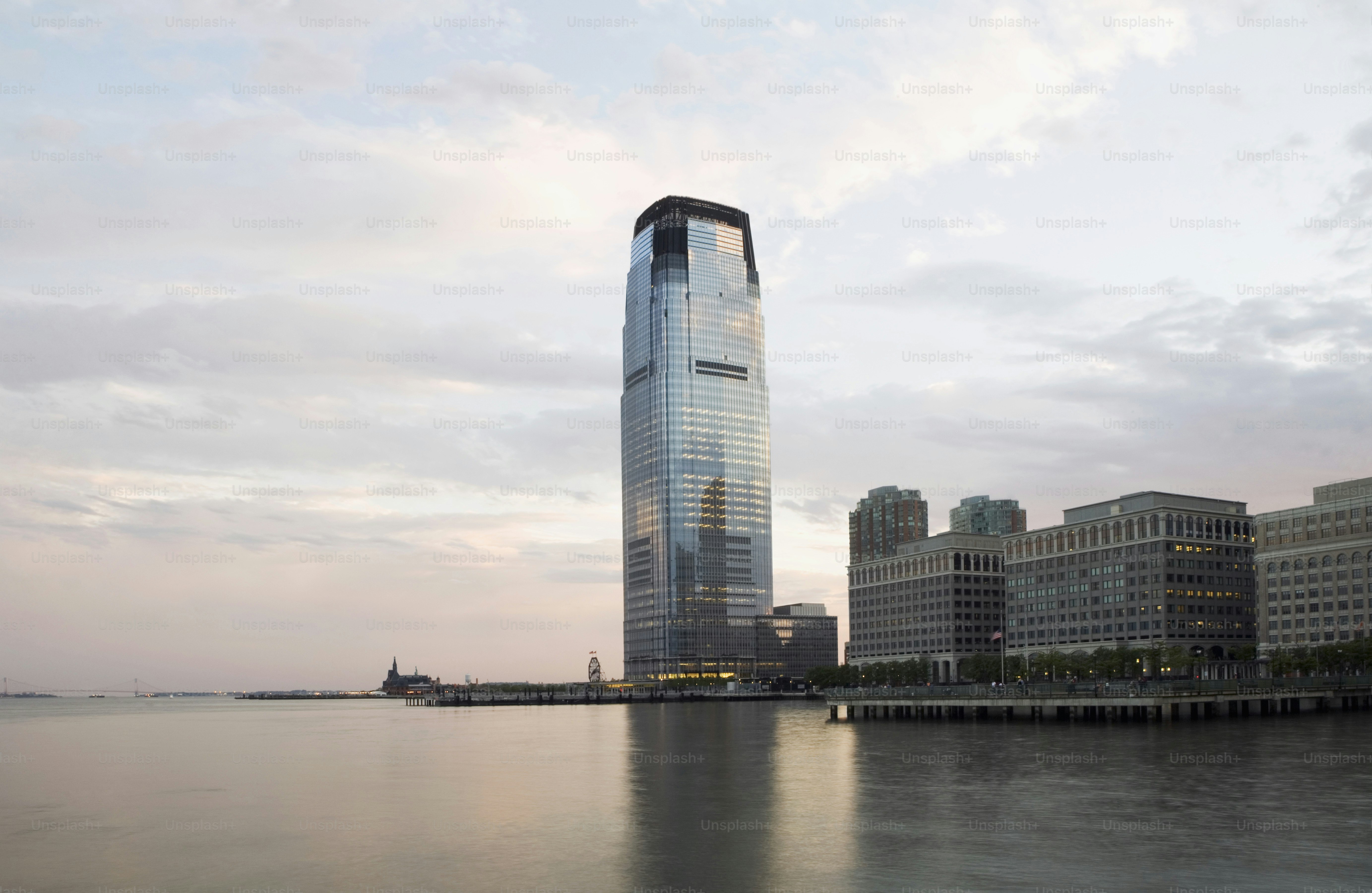 a very tall building sitting in the middle of a body of water