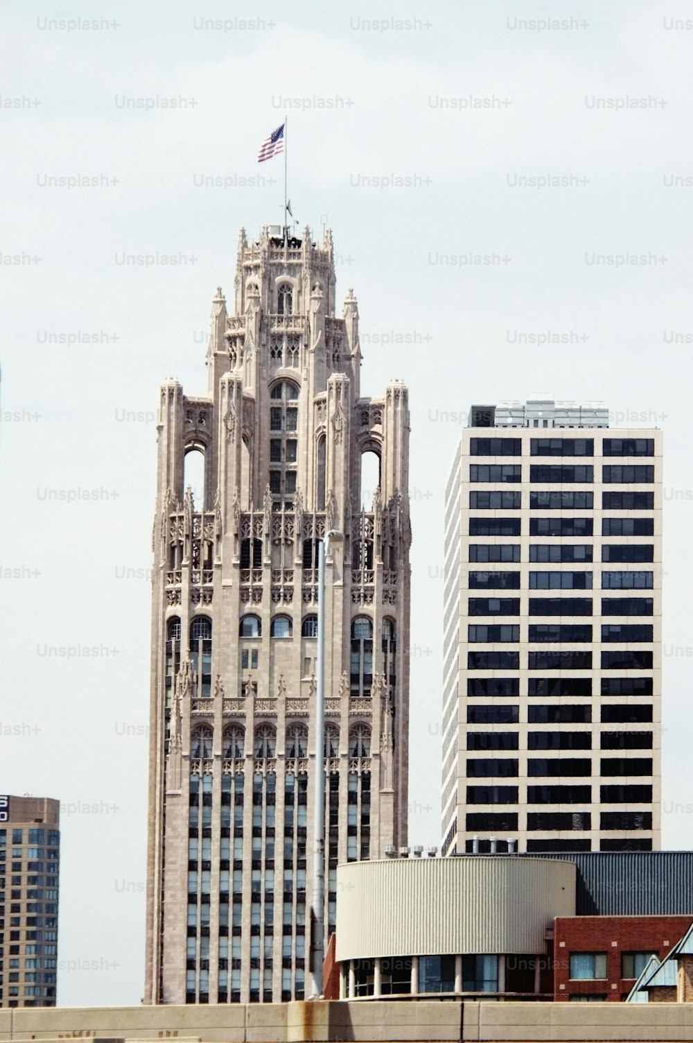 a tall building with a flag on top of it