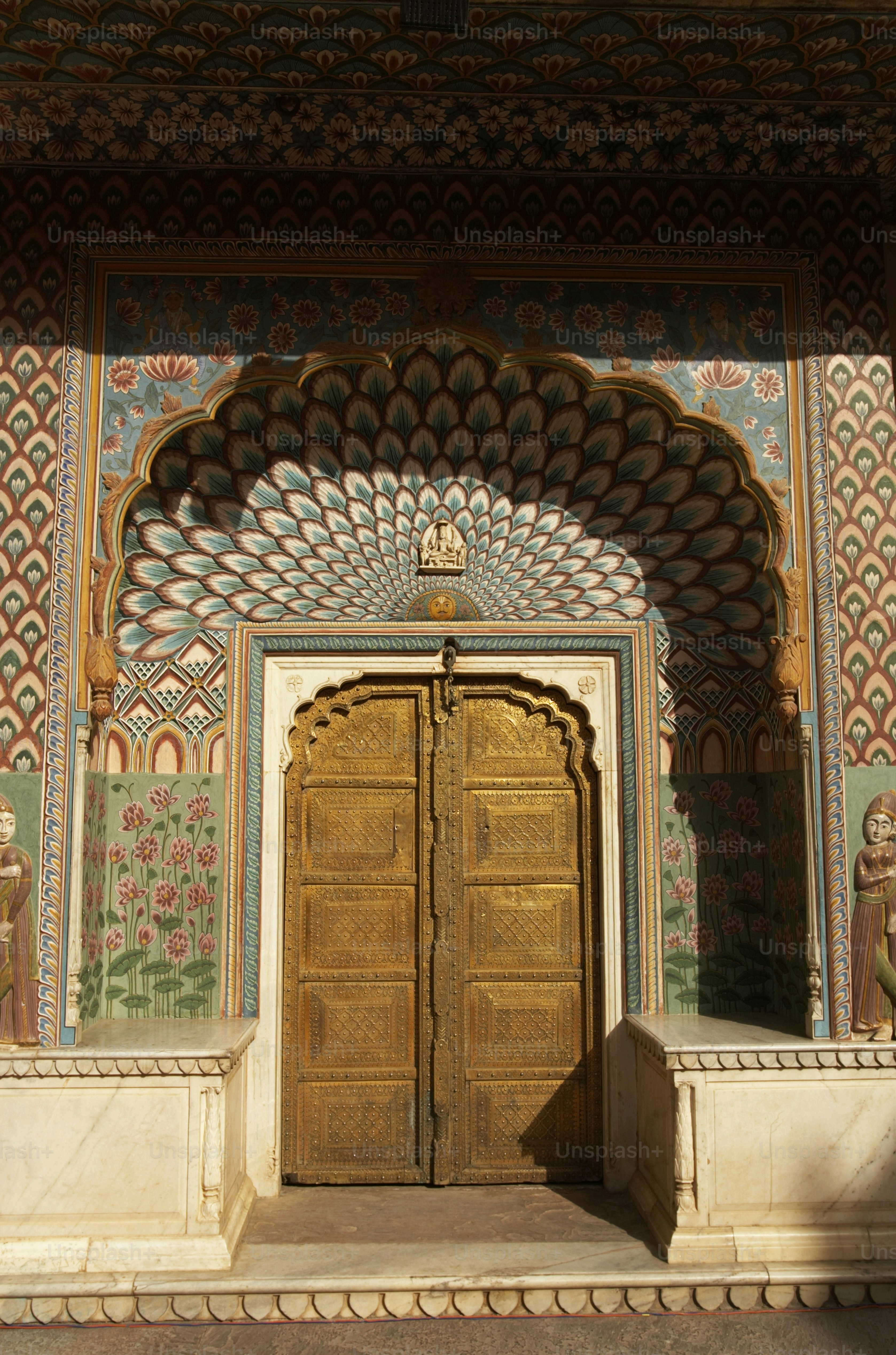 a large wooden door sitting inside of a building