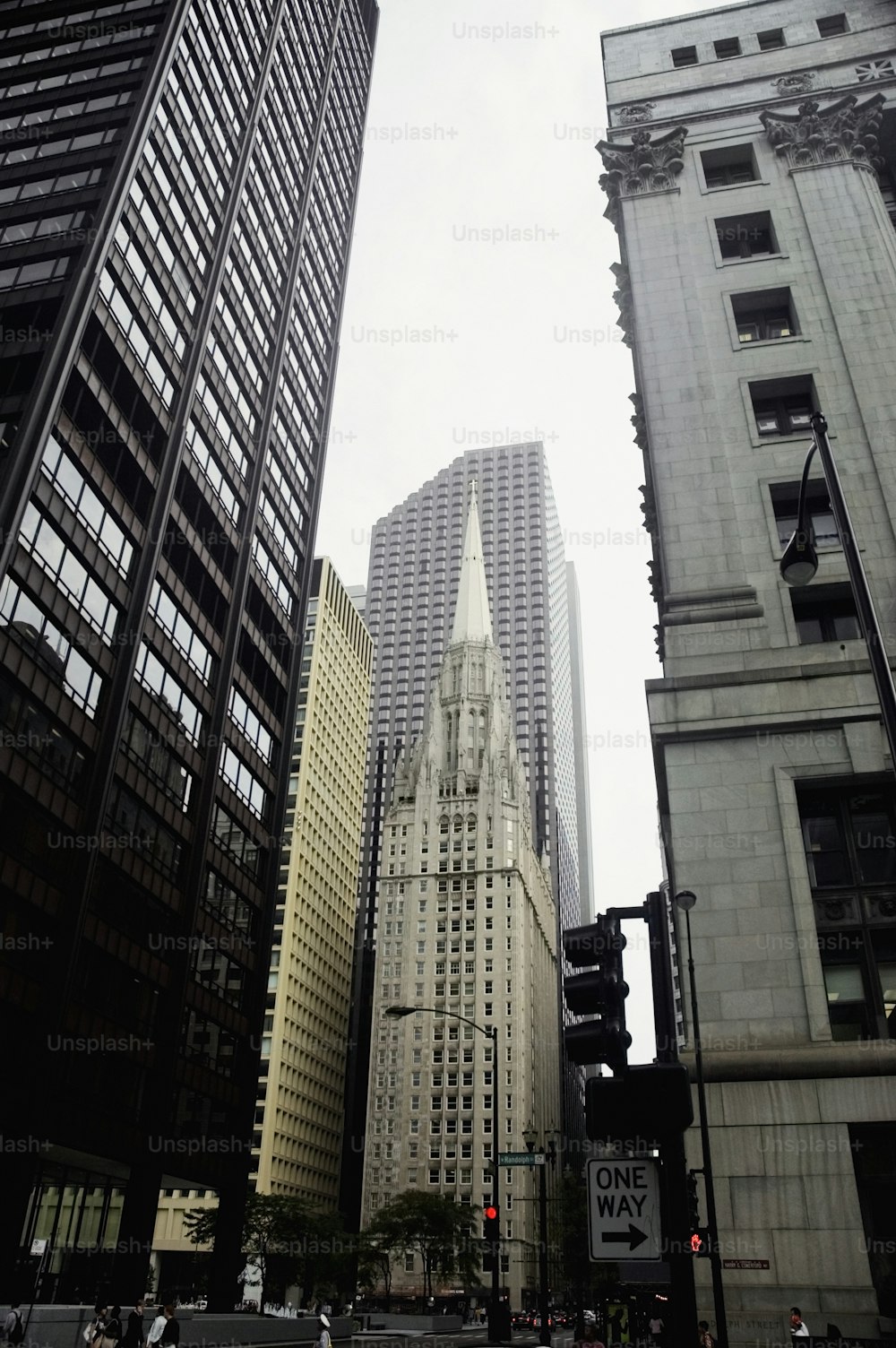 a city street with tall buildings and a traffic light