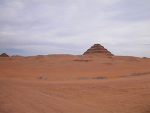 a dirt road in the middle of a desert