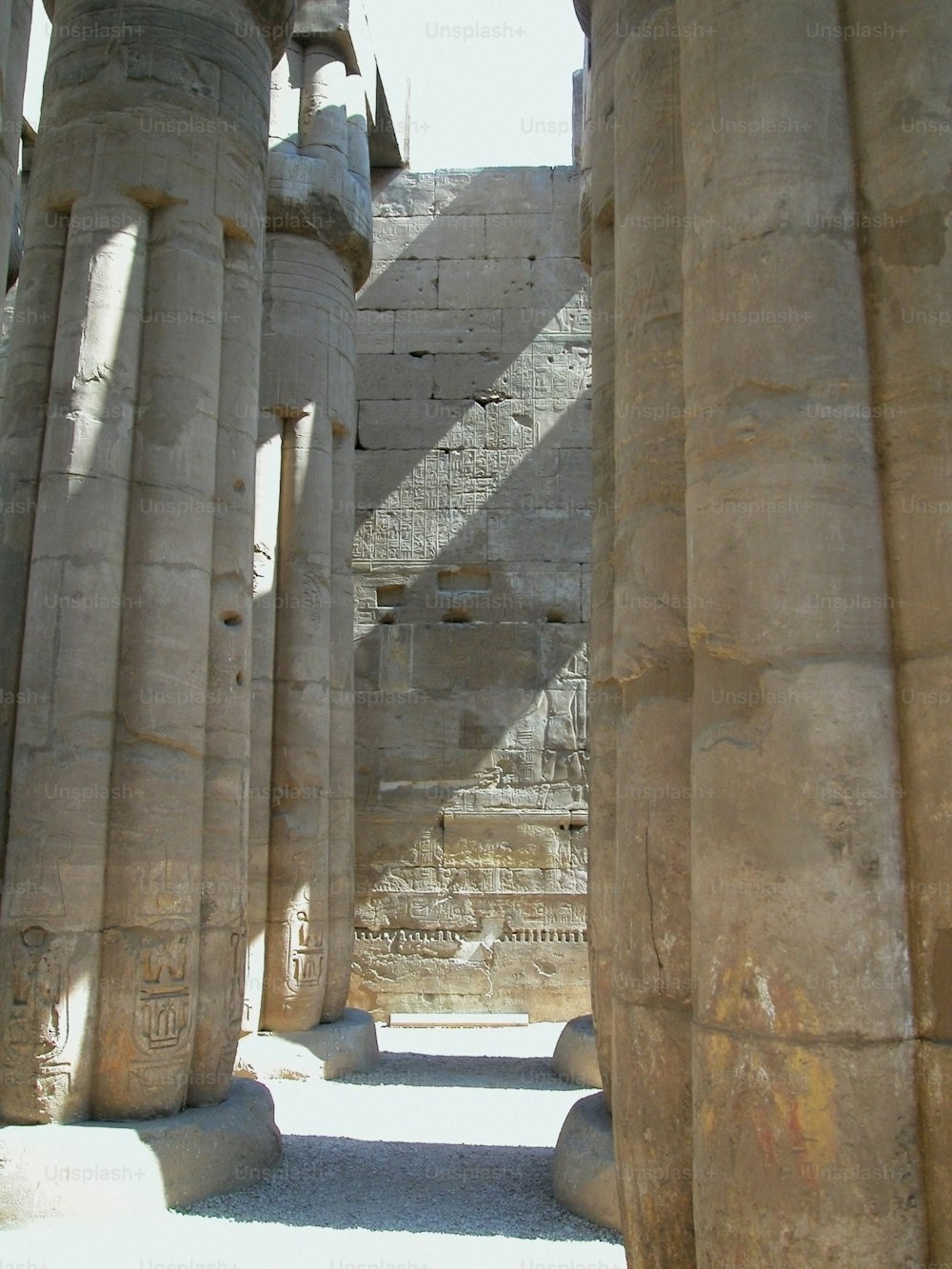 a group of large stone pillars in a building