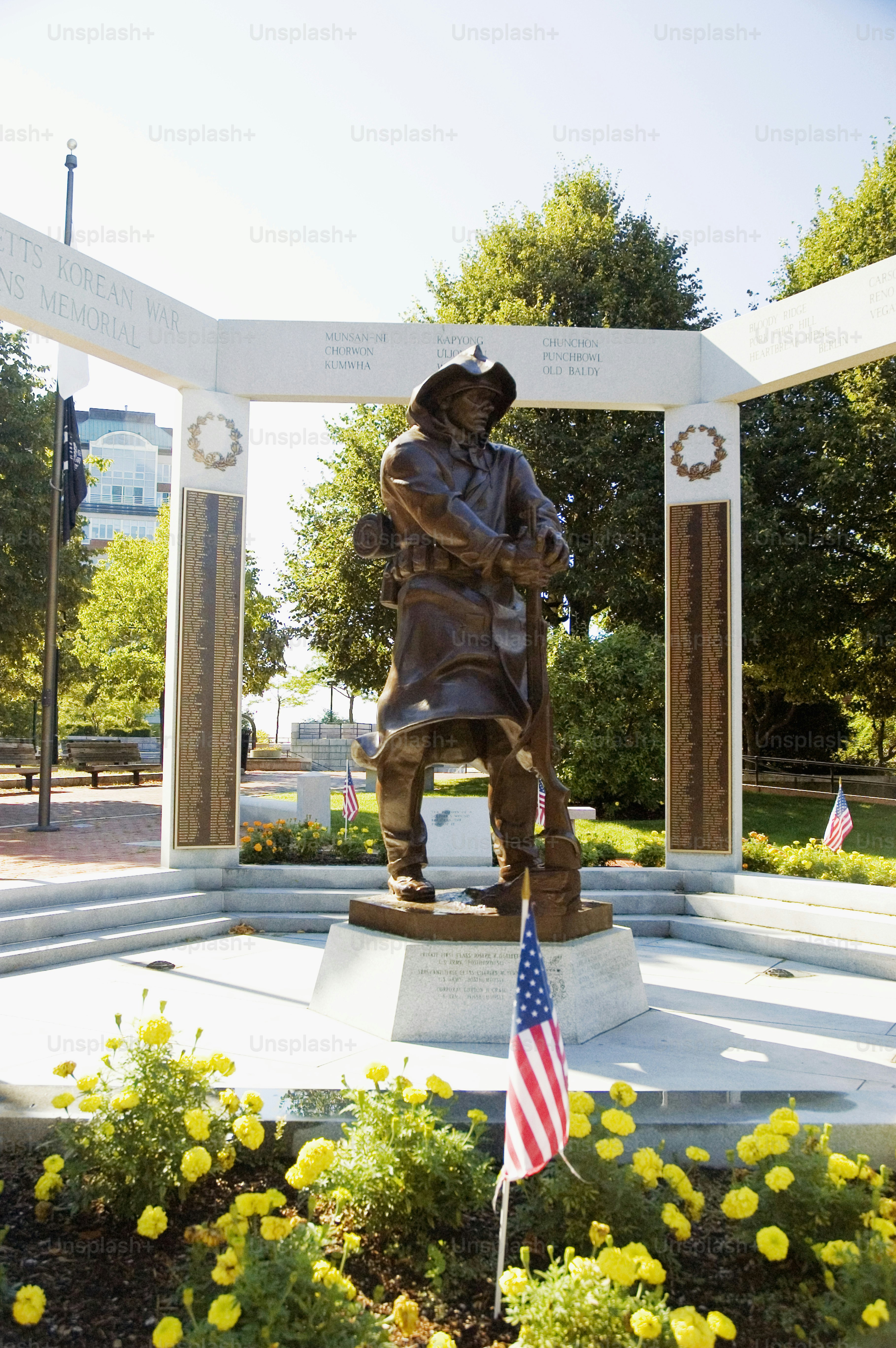 a statue of a man holding a flag